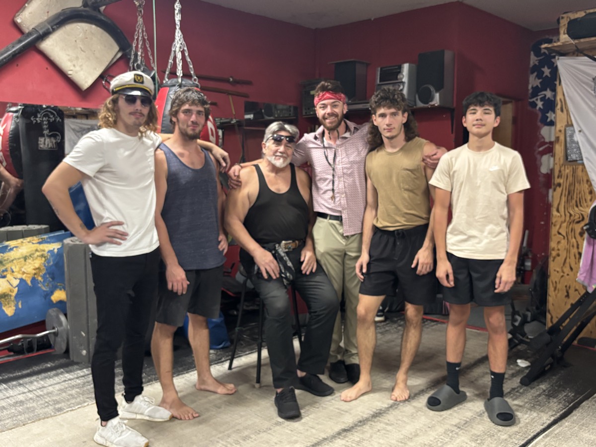 Rob with his father Scott, his three brothers, and his son in the dojo.
